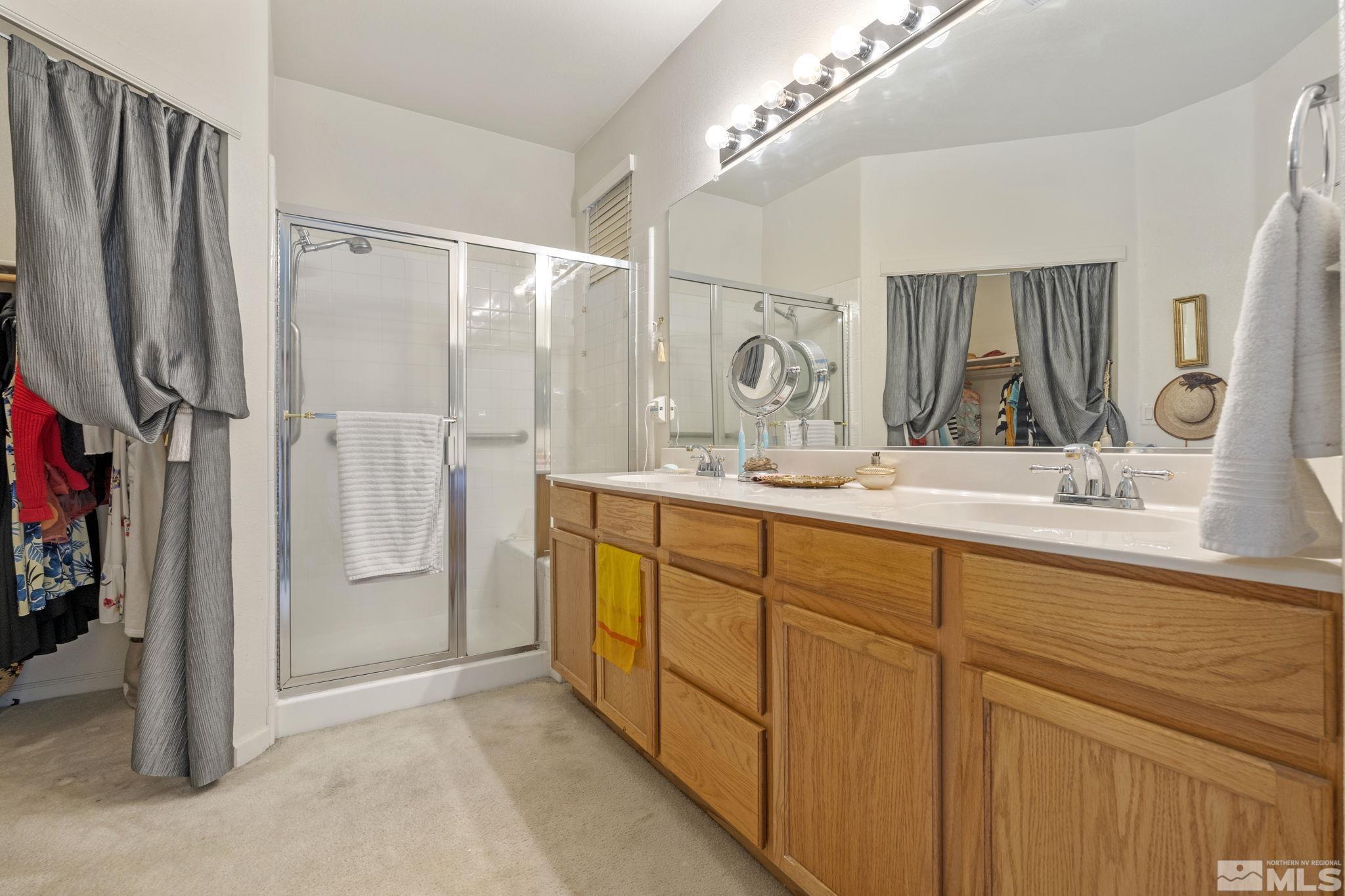10465 Summershade Lane Reno, NV 89521 - Photo 23 of 30 a bathroom with a double vanity sink mirror and double
