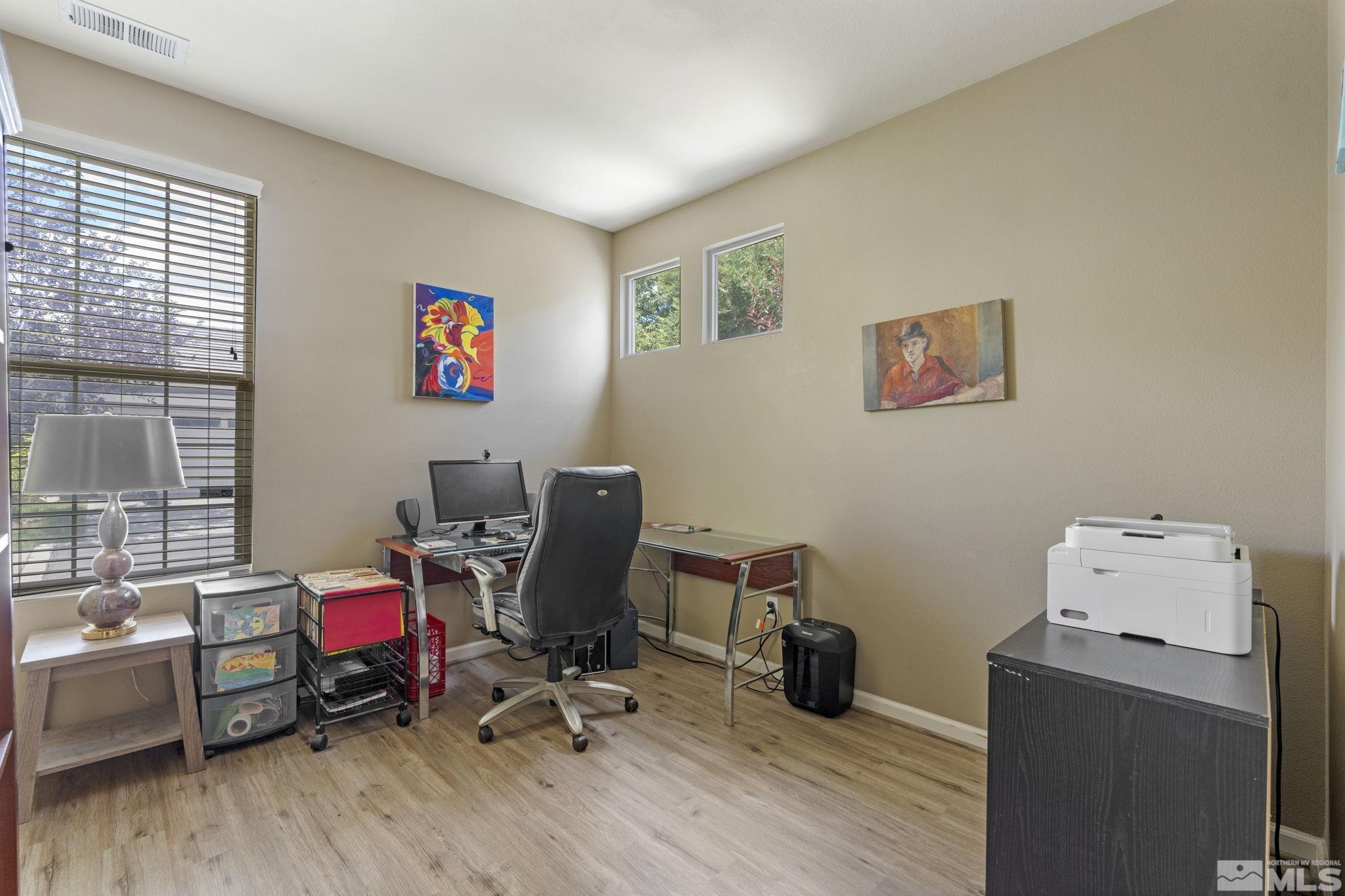 10465 Summershade Lane Reno, NV 89521 - Photo 25 of 30 a view of a workspace with furniture and a window