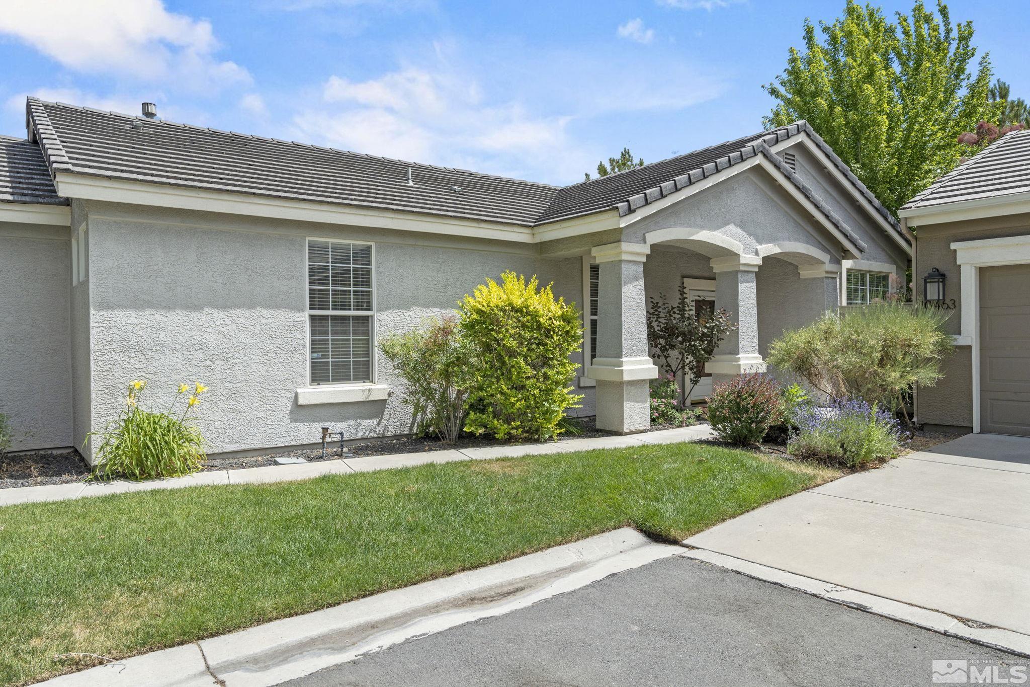 10465 Summershade Lane Reno, NV 89521 - Photo 3 of 30 a front view of a house with a yard