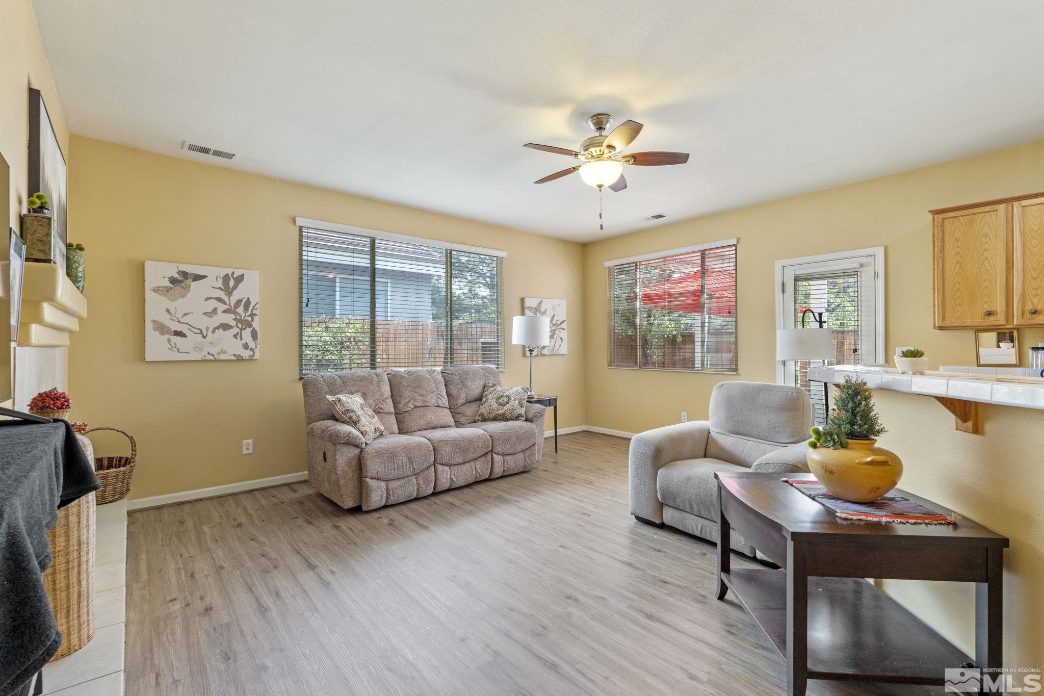 10465 Summershade Lane Reno, NV 89521 - Photo 6 of 30 a living room with furniture and a large window