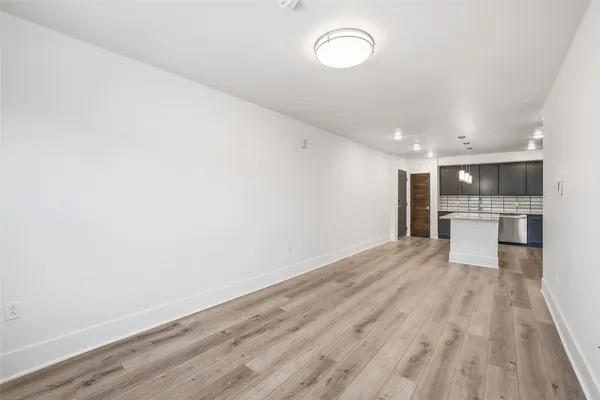 a view of kitchen with wooden floor