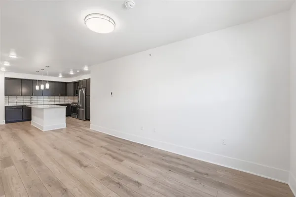 a view of kitchen with wooden floor