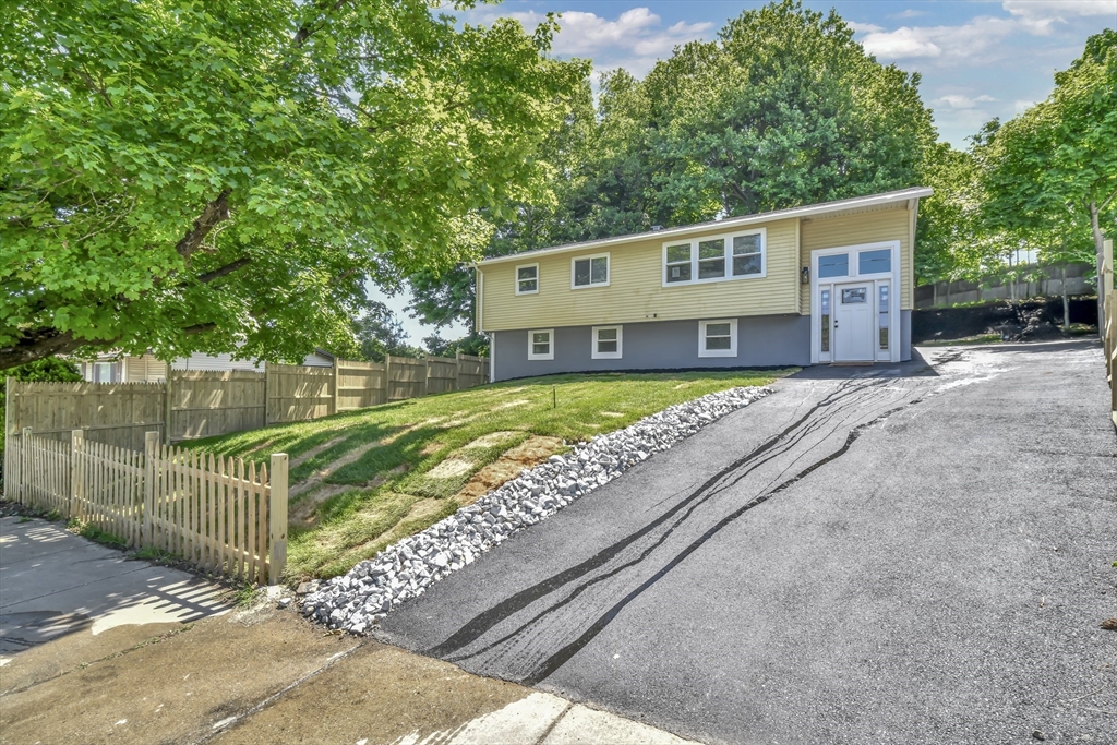 36 Dietz Road Boston, MA 02136 - Photo 1 of 31 a front view of a house with a yard with table and chairs