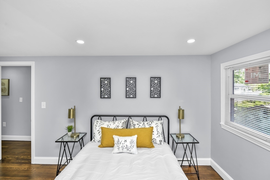 36 Dietz Road Boston, MA 02136 - Photo 17 of 31 a spacious bedroom with a bed and wooden floor