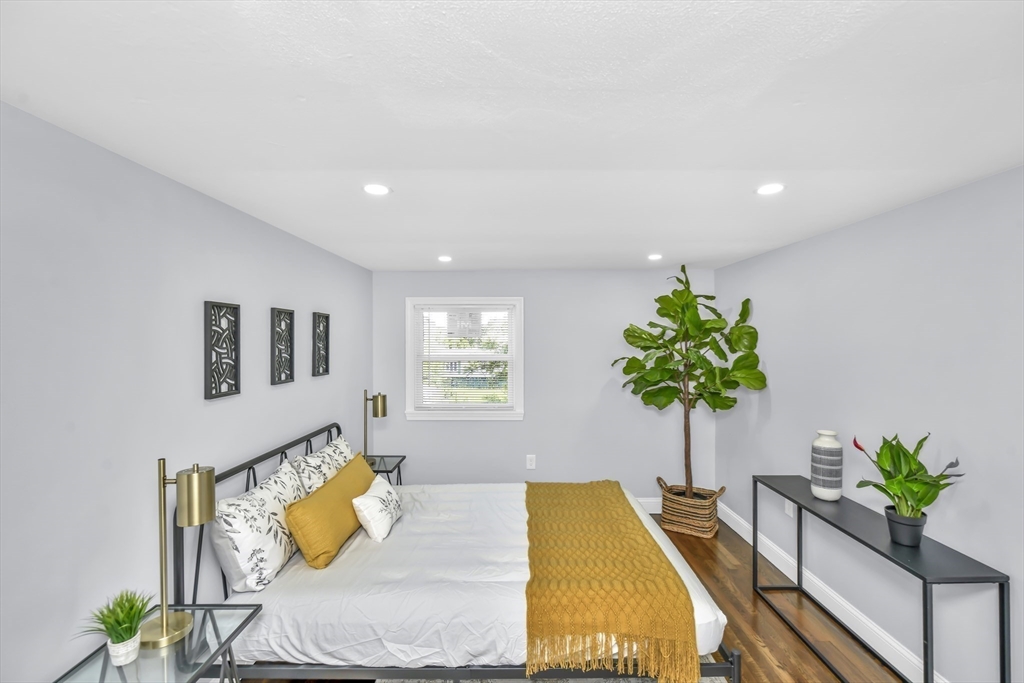 36 Dietz Road Boston, MA 02136 - Photo 18 of 31 a living room with furniture and a potted plant