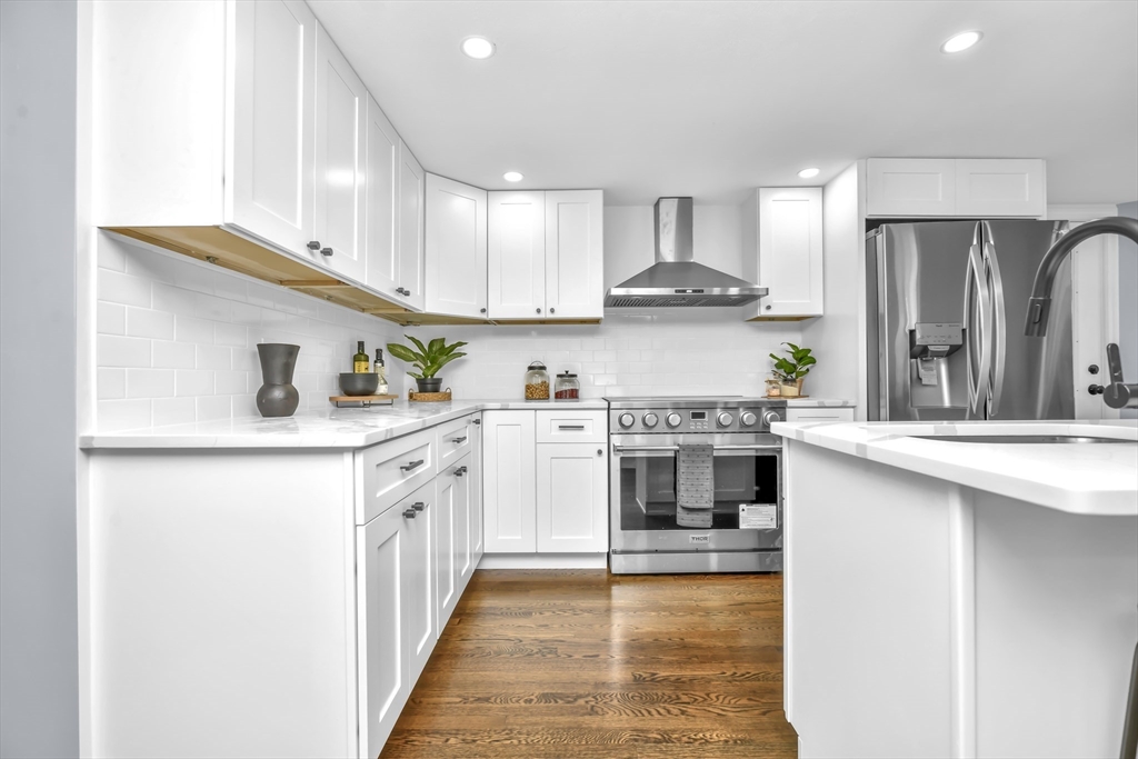 36 Dietz Road Boston, MA 02136 - Photo 4 of 31 a kitchen with stainless steel appliances granite countertop a sink and cabinets
