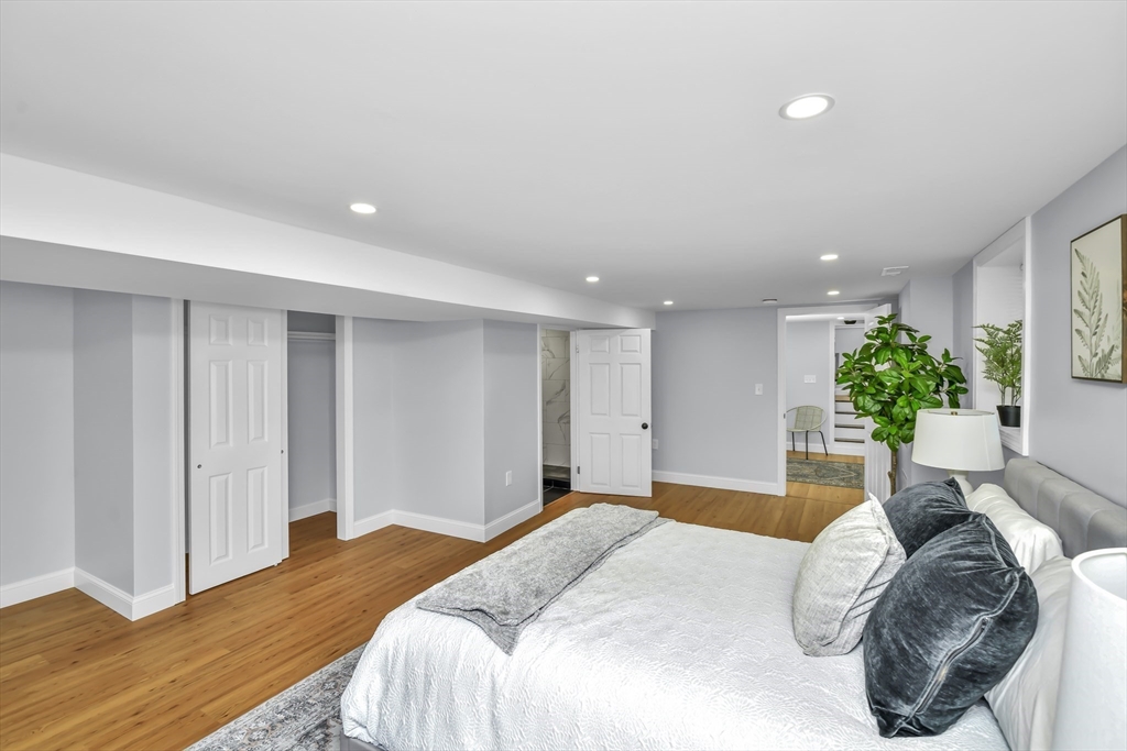 36 Dietz Road Boston, MA 02136 - Photo 8 of 31 a bedroom with a bed and a potted plant