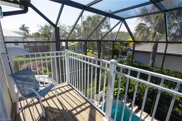 a view of balcony with furniture