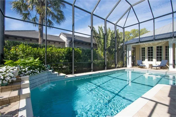 a view of a swimming pool with a patio