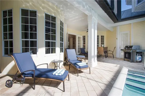 a view of a workspace with furniture and lounge chair
