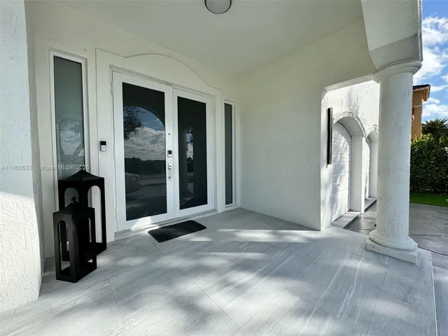 a kitchen with a sink a counter top stainless steel appliances and cabinets