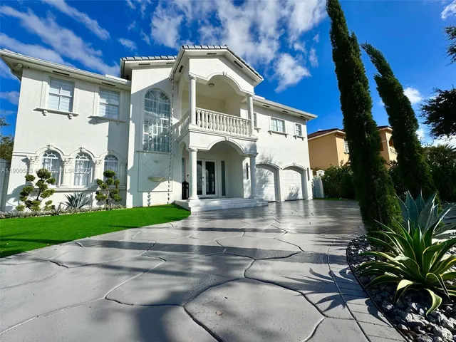 a view of a building with a yard