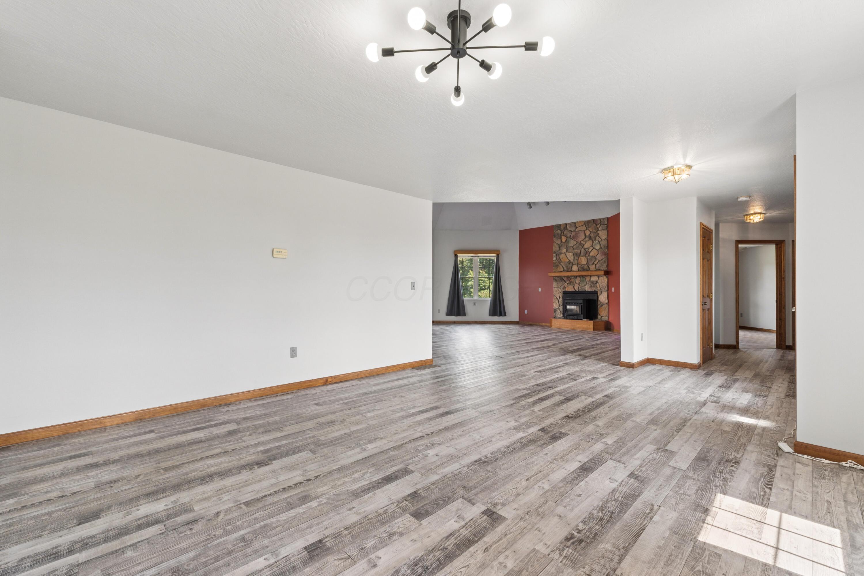 18964 London Road Circleville, OH 43113 - Photo 22 of 57 Open-concept living area featuring wood-finish flooring.