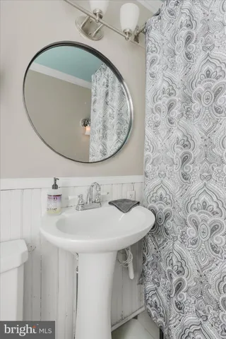 a bathroom with a sink and mirror