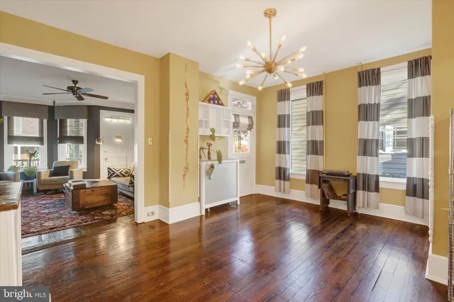 a view of a livingroom with furniture window and wooden floor