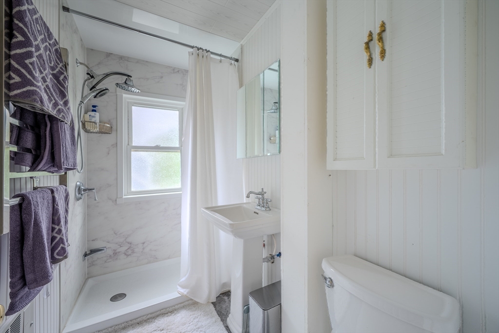 29 3rd Street Ayer, MA 01432 - Photo 11 of 29 a bathroom with a shower a toilet and a sink