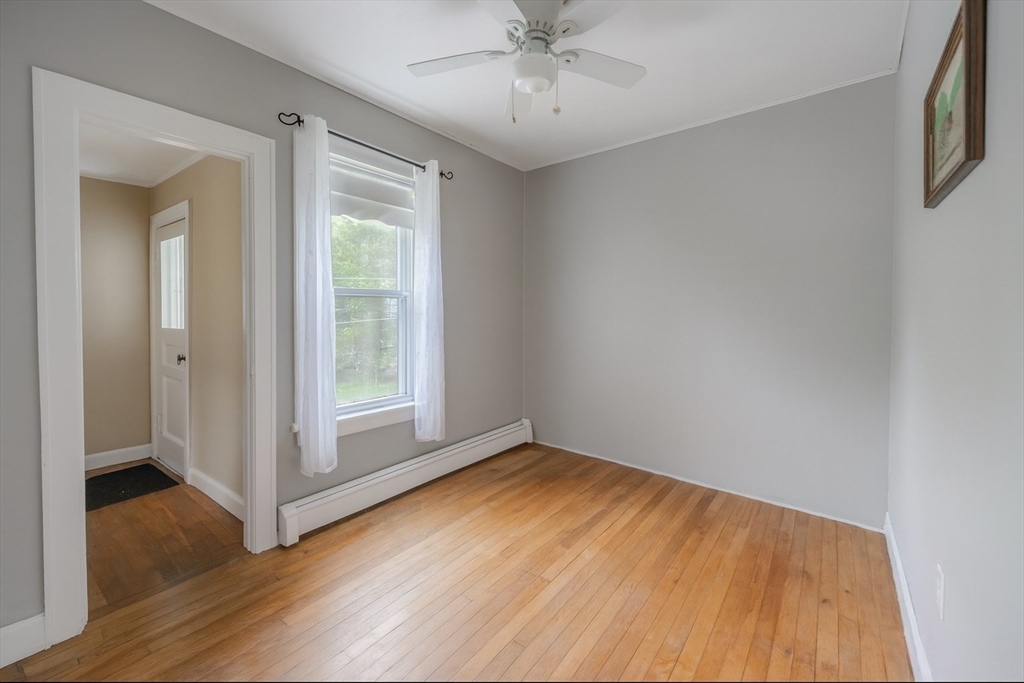 29 3rd Street Ayer, MA 01432 - Photo 13 of 29 wooden floor in an empty room with a window