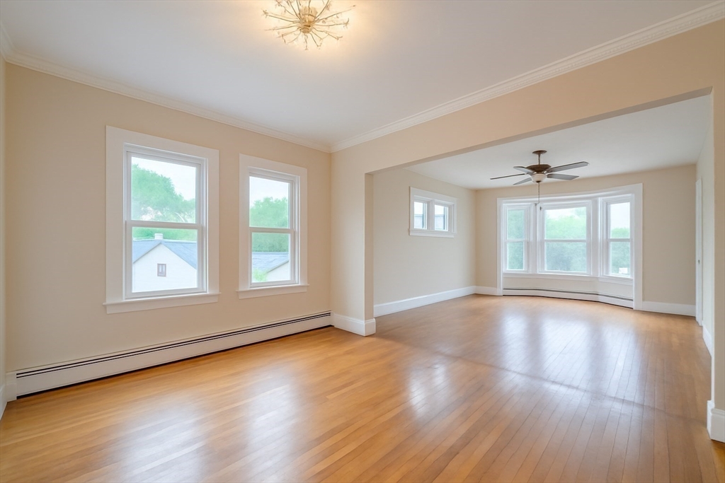 29 3rd Street Ayer, MA 01432 - Photo 19 of 29 an empty room with wooden floor and windows