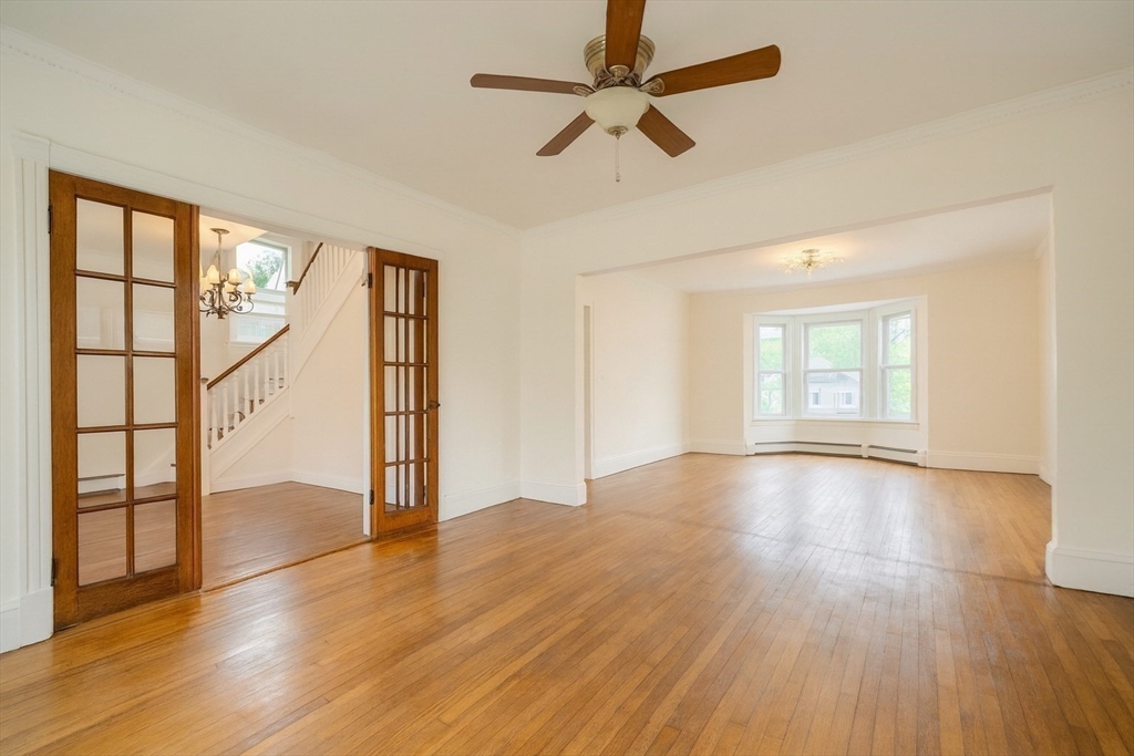 29 3rd Street Ayer, MA 01432 - Photo 20 of 29 an empty room with wooden floor fan and windows