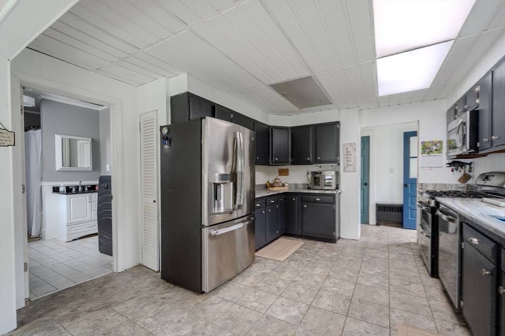 29 3rd Street Ayer, MA 01432 - Photo 7 of 29 a kitchen with stainless steel appliances granite countertop a refrigerator stove and sink
