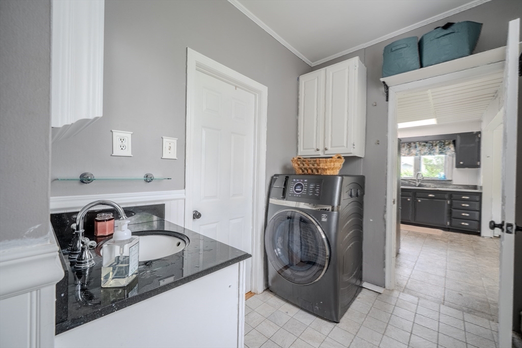 29 3rd Street Ayer, MA 01432 - Photo 10 of 29 a kitchen with kitchen island a stove a sink and a refrigerator