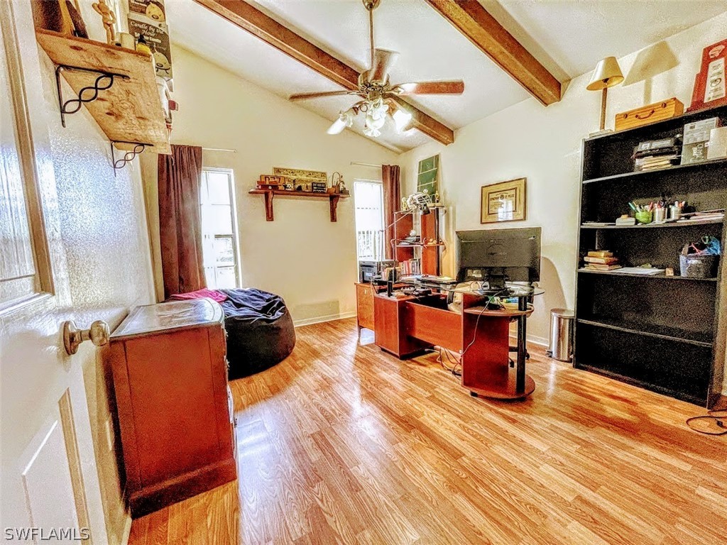 3015 Shell Lane LaBelle, FL 33935 - Photo 17 of 24 a kitchen with stainless steel appliances kitchen island granite countertop a refrigerator a stove and a wooden cabinets