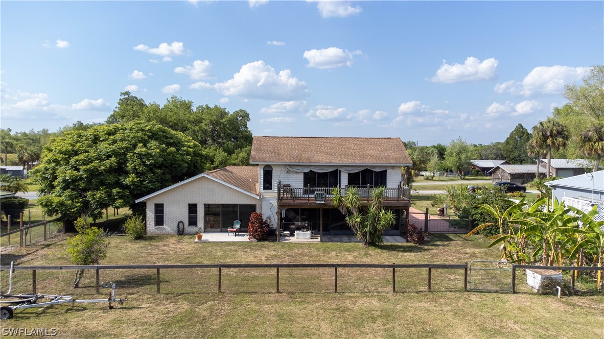 3015 Shell Lane LaBelle, FL 33935 - Photo 22 of 24 a front view of a house with garden