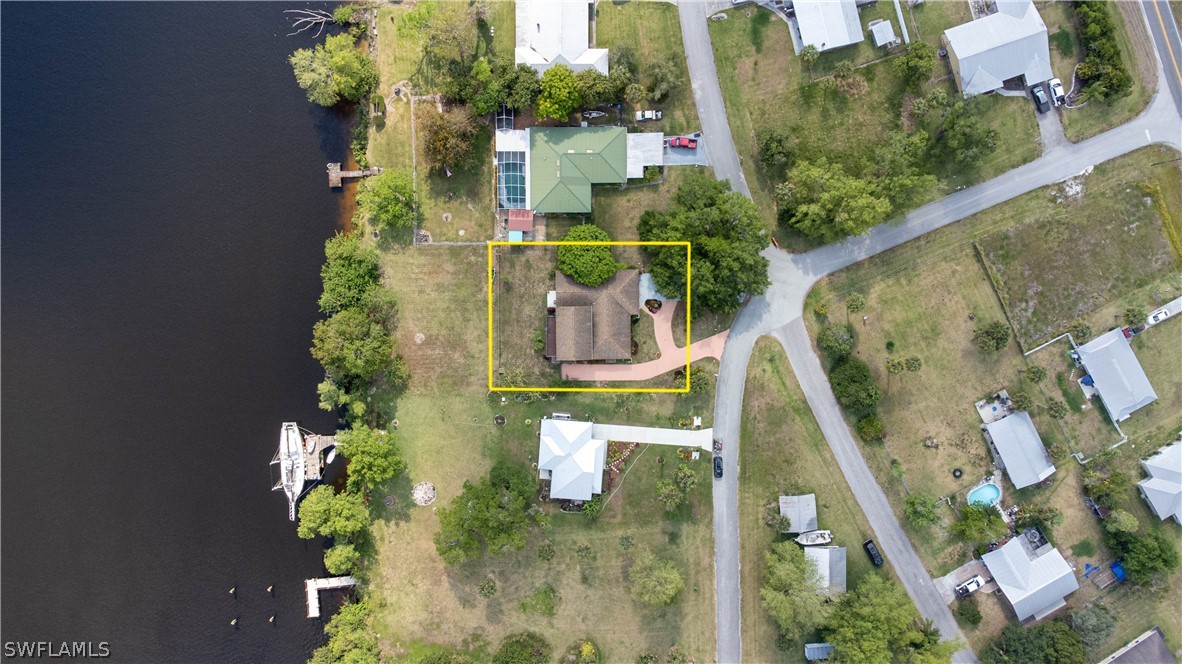 3015 Shell Lane LaBelle, FL 33935 - Photo 23 of 24 an aerial view of a house with outdoor space pool seating area and lots of plants