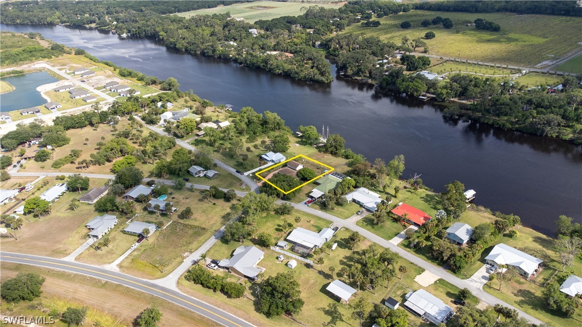 3015 Shell Lane LaBelle, FL 33935 - Photo 7 of 24 a view of a lake with a flower garden