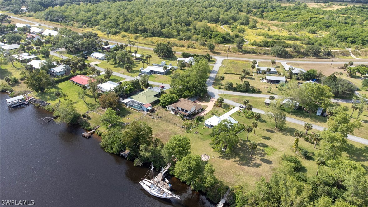 3015 Shell Lane LaBelle, FL 33935 - Photo 9 of 24 an aerial view of residential houses with outdoor space and trees