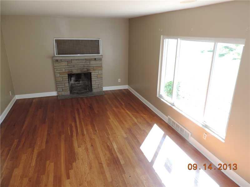 170 Ridgewood Road Pittsburgh, PA 15237 - Photo 2 of 13 Living Room. The formal living room has original hardwood flooring in escellent condition and a pretty stone logburning fireplace