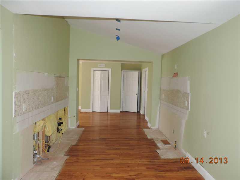 170 Ridgewood Road Pittsburgh, PA 15237 - Photo 5 of 13 Kitchen. NOW, a little imagination is needed. This is where the kitchen will go. The prior owner began a remodel and then did not fiinish. The folding door in the back ground hides a plumbed in closet for a first floor stackable laundry unit