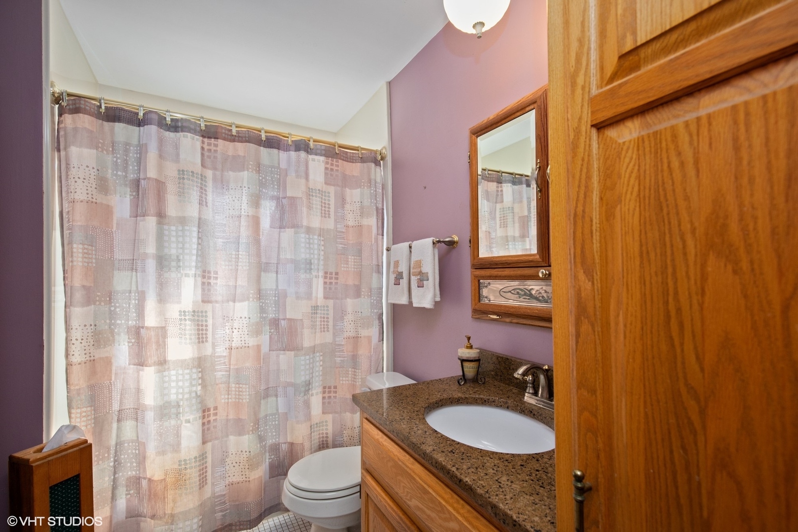 355 Chenault Road Buffalo Grove, IL 60089 - Photo 19 of 26 a bathroom with a granite countertop toilet sink and mirror