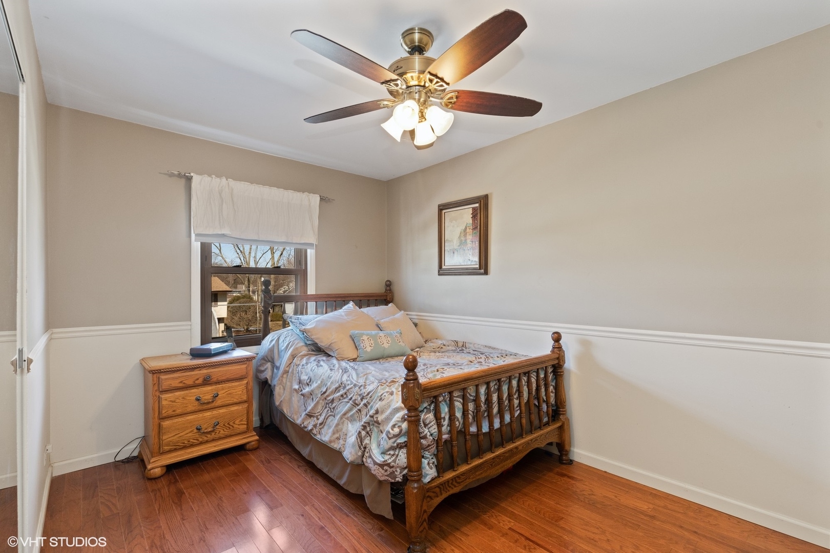 355 Chenault Road Buffalo Grove, IL 60089 - Photo 21 of 26 a bedroom with a bed and a chandelier