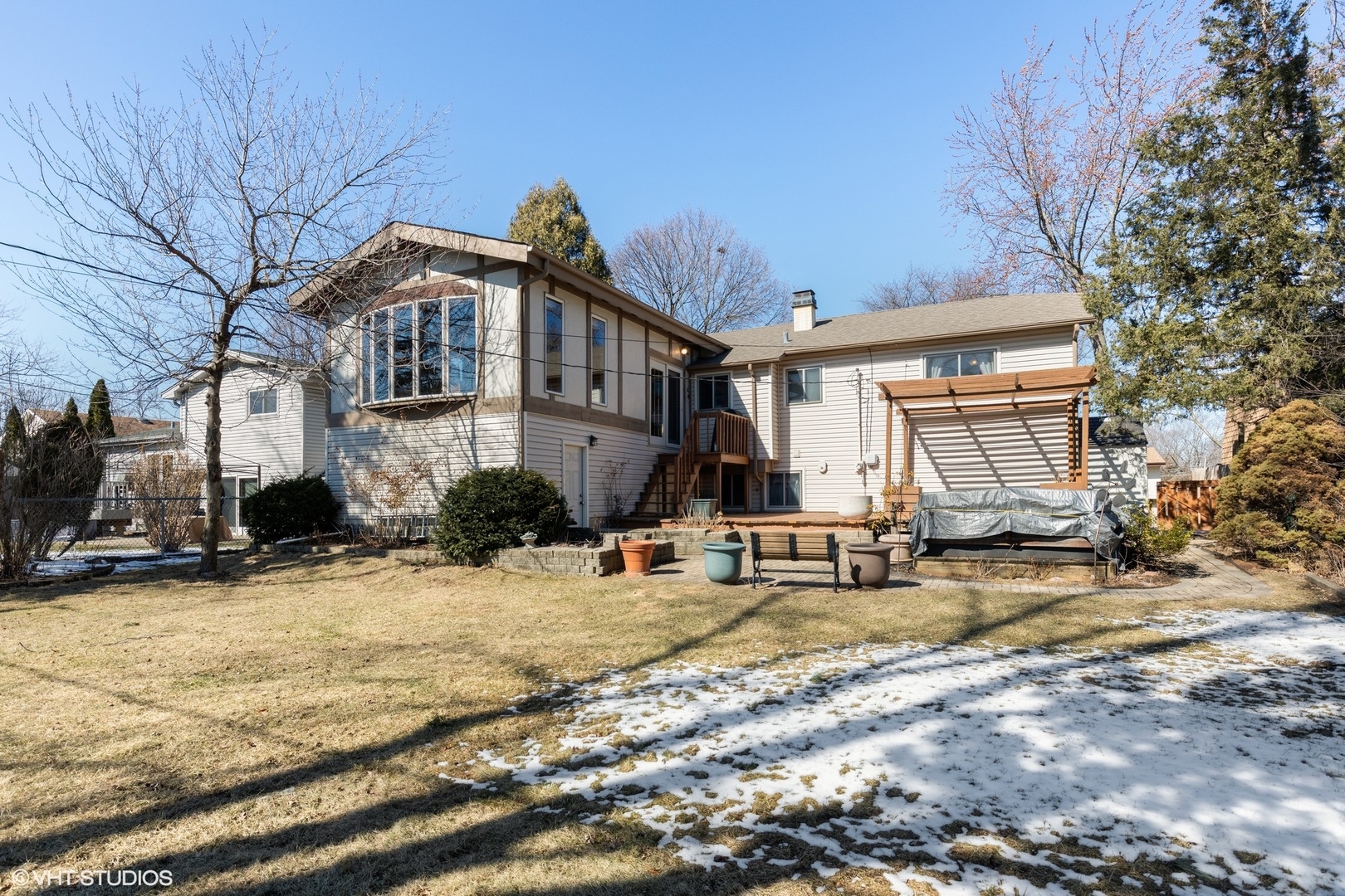 355 Chenault Road Buffalo Grove, IL 60089 - Photo 26 of 26 a view of a house with snow on the side of the road