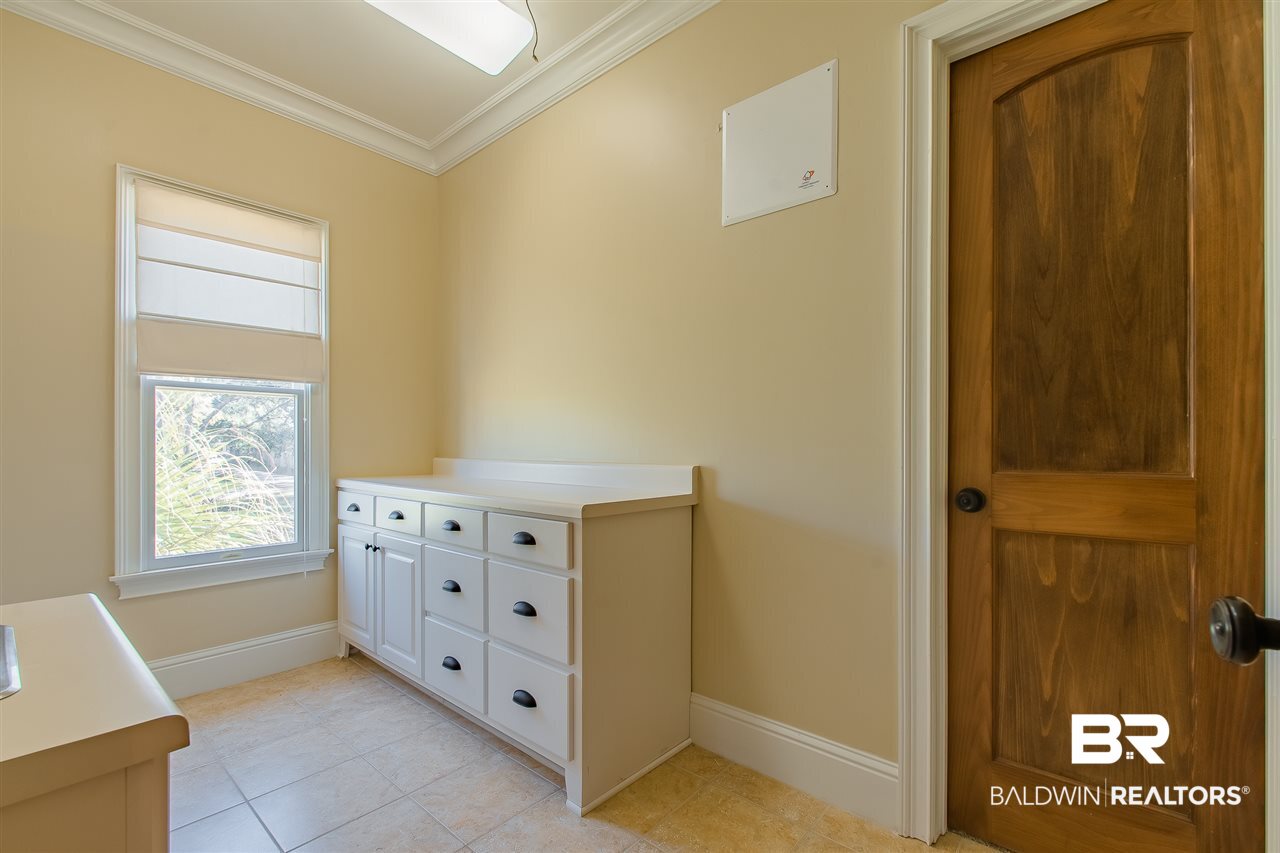 34 Viale Bellezza Fairhope, AL 36532 - Photo 37 of 42 Upstairs laundry with sto
