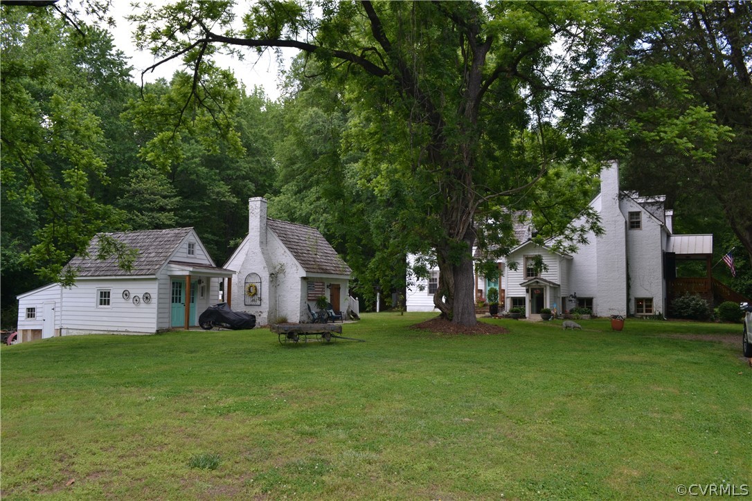 12200 Old Buckingham Road Midlothian, VA 23113 - Photo 3 of 9 Sideview of house and outbuildings.