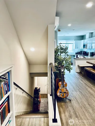 a living room with furniture and a book shelf