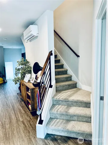 a view of an entryway with wooden floor