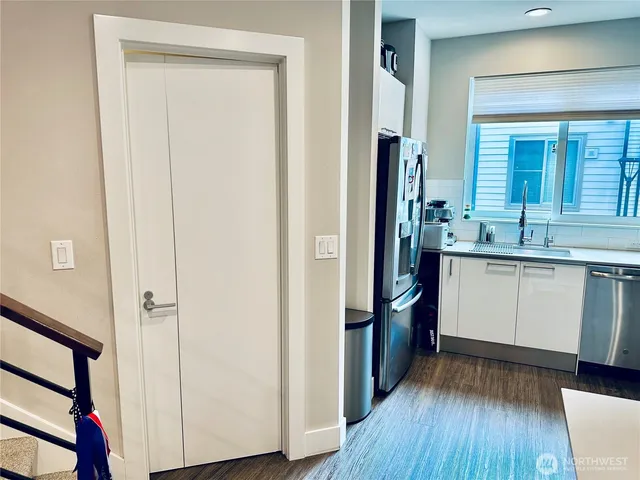 a kitchen with a sink and refrigerator