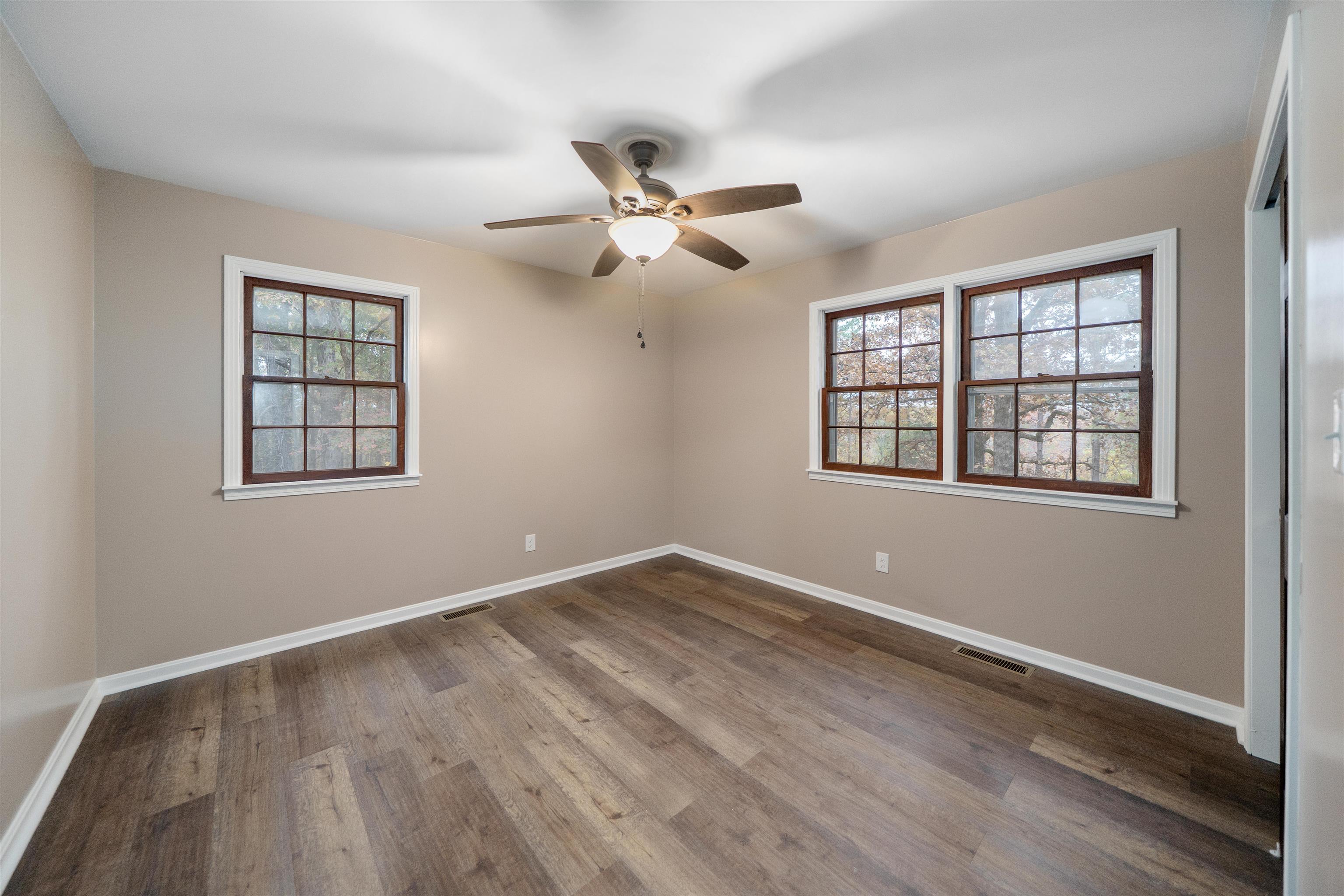 567 South 6th Street Selmer, TN 38375 - Photo 28 of 31 Spare room with plenty of natural light, wood finished floors, and ceiling fan