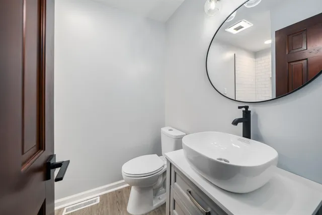 a bathroom with a glass shower door