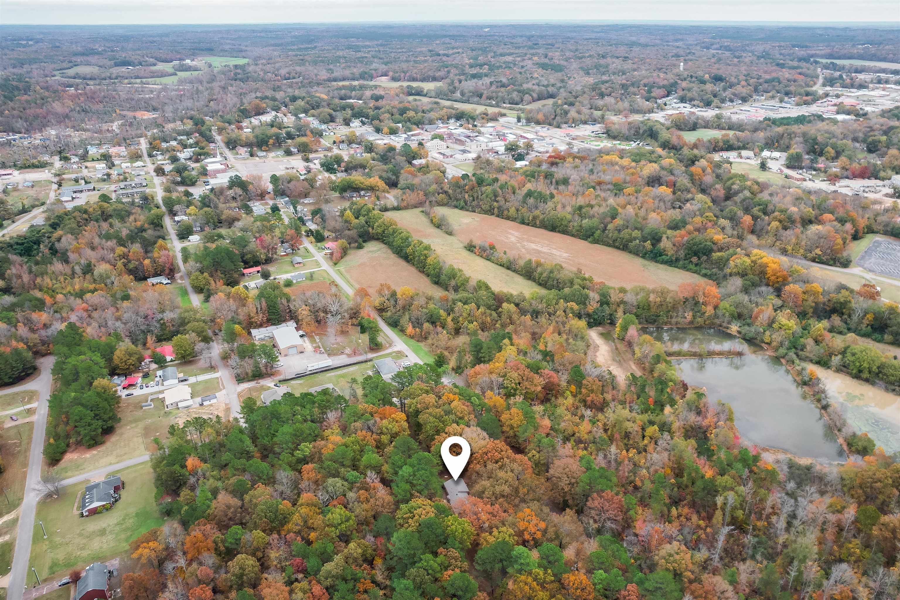 567 South 6th Street Selmer, TN 38375 - Photo 3 of 31 Aerial view of property and surrounding area featuring a large body of water