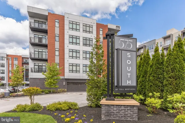 a front view of a building with street view