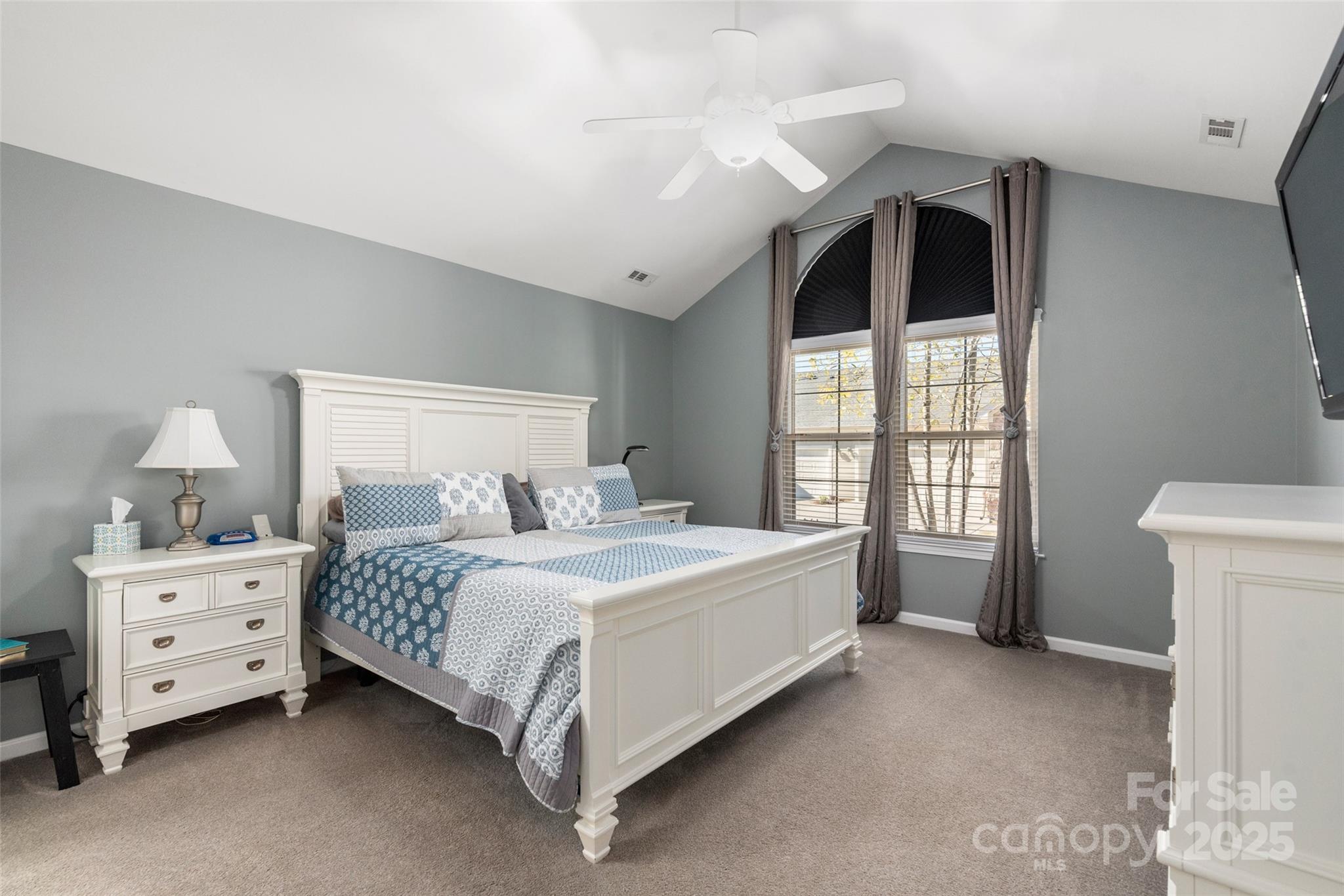 874 Ledgestone Court Tega Cay, SC 29708 - Photo 18 of 38 a bedroom with a bed and a window