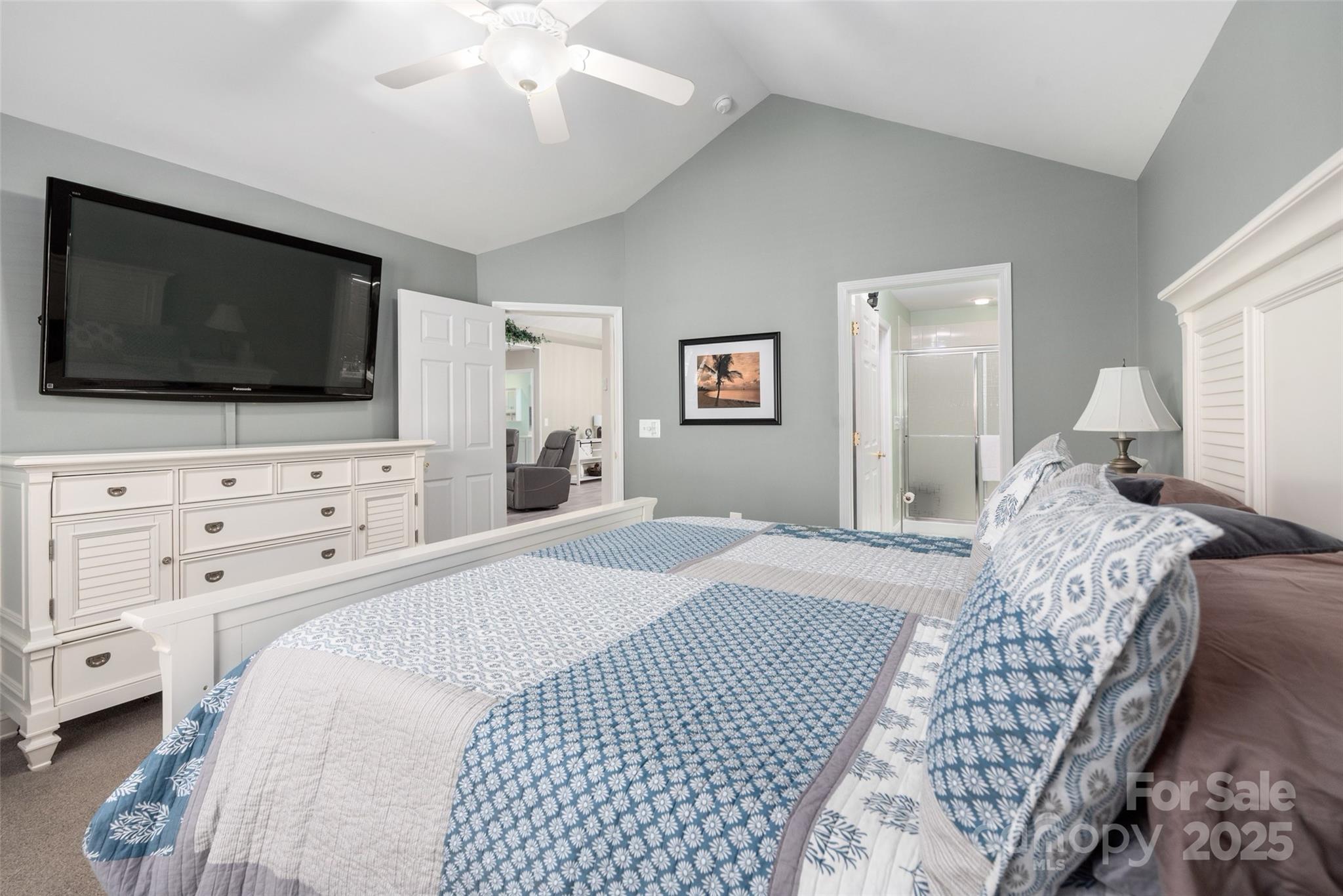 874 Ledgestone Court Tega Cay, SC 29708 - Photo 20 of 38 a bedroom with a bed and a flat screen tv