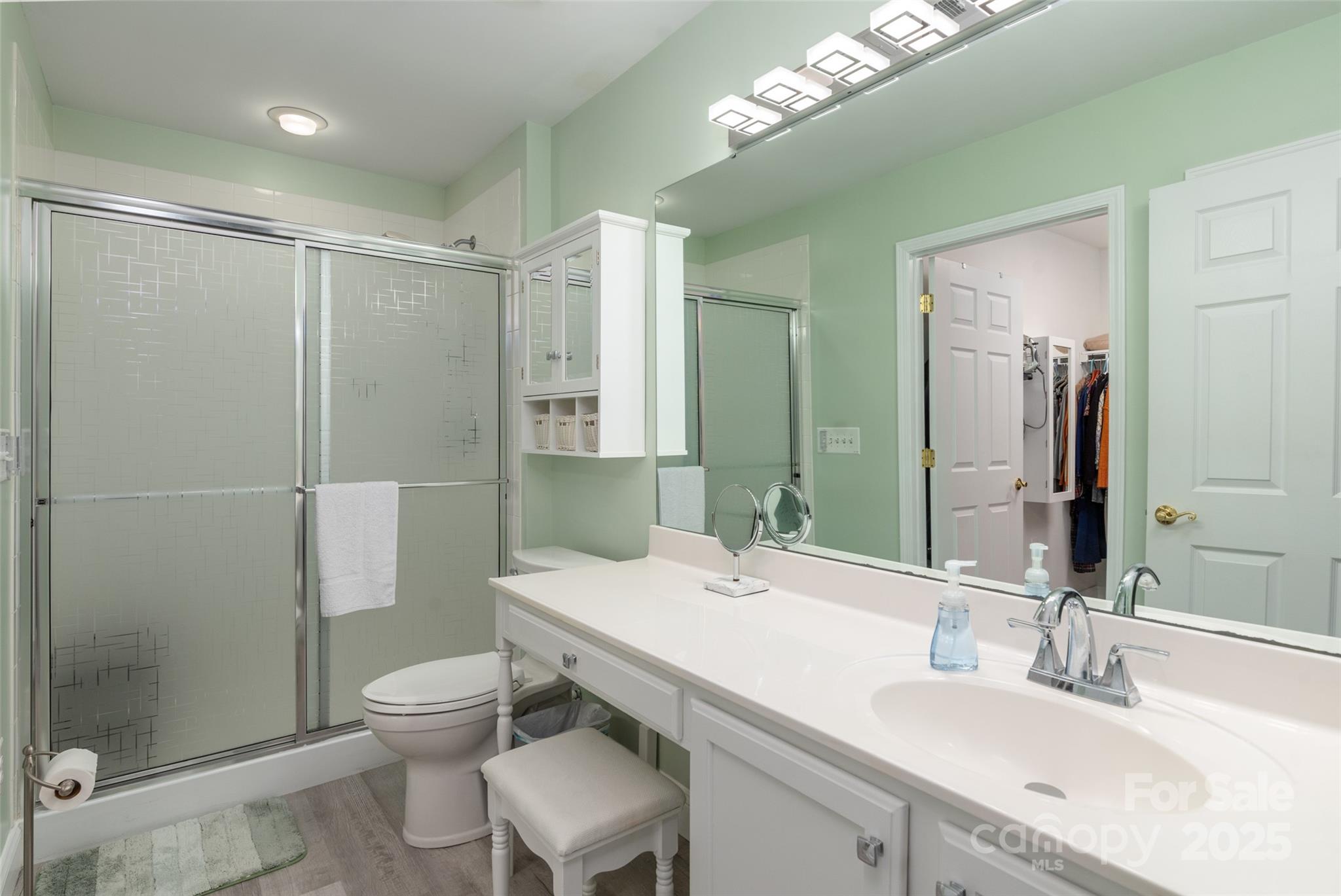 874 Ledgestone Court Tega Cay, SC 29708 - Photo 21 of 38 a bathroom with a sink toilet and shower