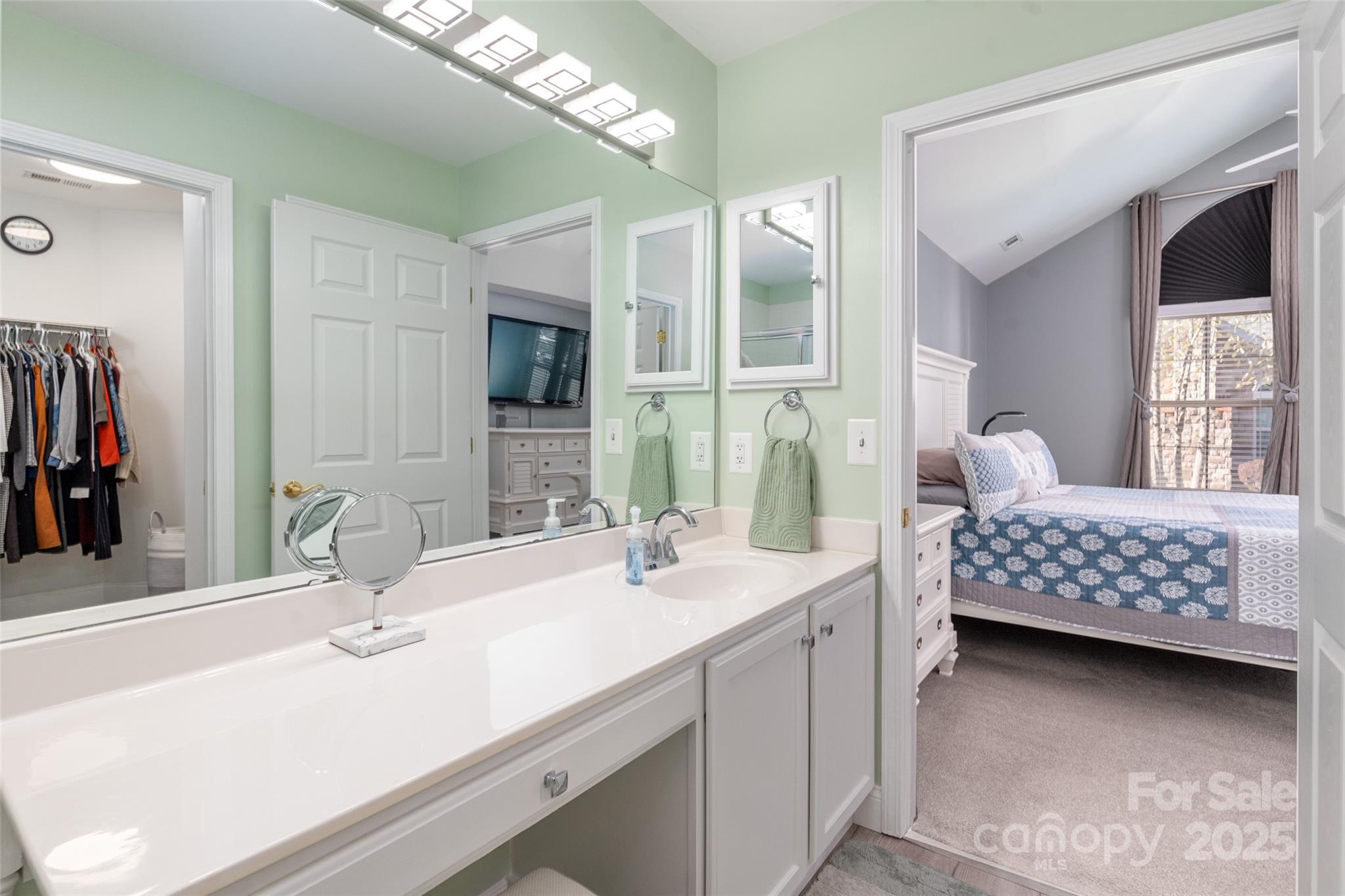 874 Ledgestone Court Tega Cay, SC 29708 - Photo 22 of 38 a bathroom with a sink double vanity and a mirror