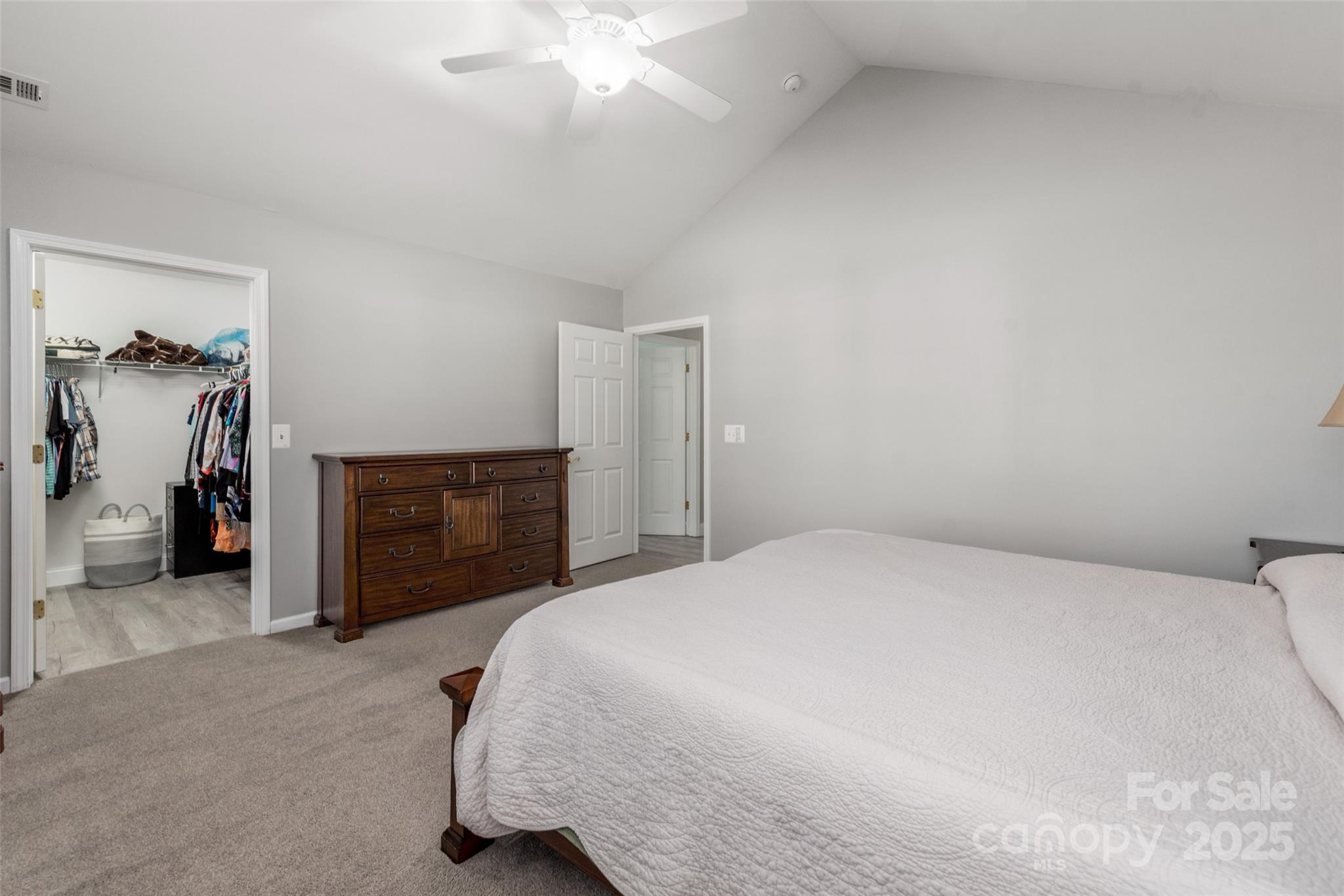 874 Ledgestone Court Tega Cay, SC 29708 - Photo 24 of 38 a bedroom with a bed and a fireplace