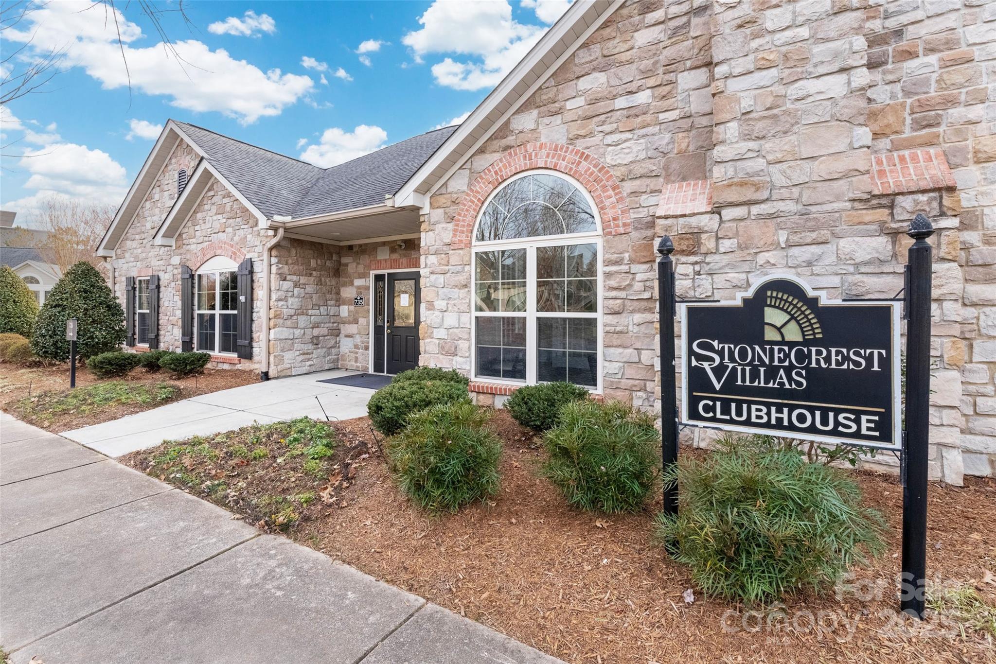 874 Ledgestone Court Tega Cay, SC 29708 - Photo 29 of 38 a front view of a building with garden